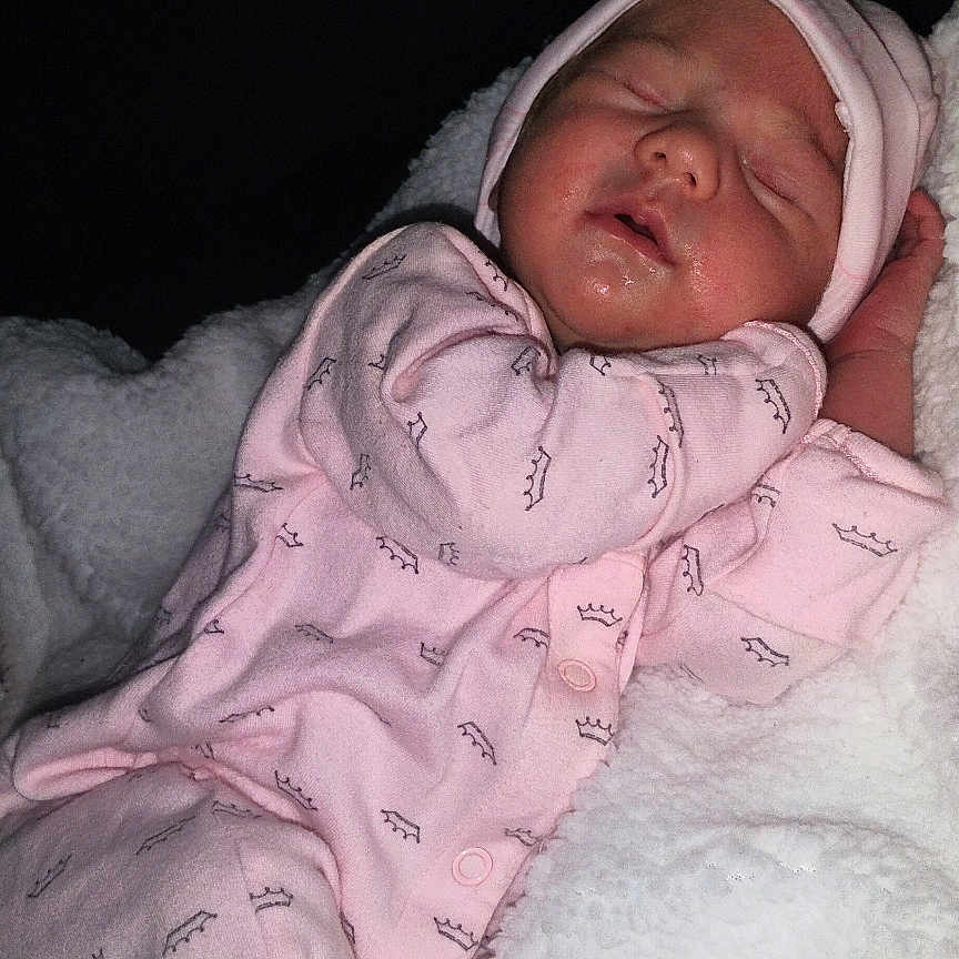Anaya Cienna joined the competition — help win amazing prizes! baby, newborn, sleeping, pink_pajamas, hat, blanket, cozy, infant, soft, cute, resting, child, indoors, peaceful, portrait, warm, clothing, toddler, sleep, face