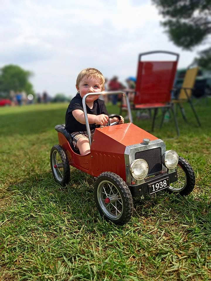 Aubrey V joined the competition — help win amazing prizes! automotive_design, automotive_exterior, automotive_tire, automotive_wheel_system, car, classic_car, cloud, grass, kit_car, lawn, locking_hubs, motor_vehicle, person, plant, riding_toy, sky, tire, toddler, tread, vehicle