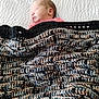 newborn, baby, sleeping, blanket, knitted_blanket, bedspread, cozy, peaceful, infant, child, indoor, portrait, resting, soft, warm, cute, head, face, pink_clothing, texture