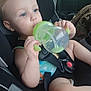 Benjamin joined the competition — help win amazing prizes! toddler, child, car_seat, sippy_cup, blue_eyes, seatbelt, car_interior, baby, person, young_child, holding, green, drinking, casual, infant, cute, sitting, safety, closeup, vehicle