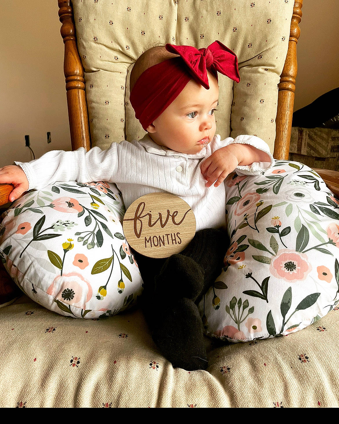 Sophia is registered to the contest to win money with this photo: baby, baby_sleeping, baby_toddler_clothing, bag, bedding, cap, child, comfort, font, headwear, human_leg, knee, linens, pattern, person, plaid, sitting, sleeve, textile, thigh