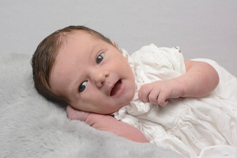 Mélyssa participe au concours pour gagner de l'argent avec cette photo : baby, baby_toddler_clothing, cheek, child, comfort, dress, eyebrow, flash_photography, fur, happy, headgear, human_body, iris, linens, lip, nose, person, sitting, sleeve, smile