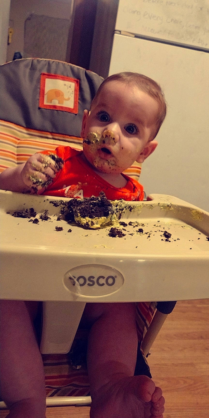 Kacesyn is registered to the contest to win money with this photo: baby, baby_food, baby_toddler_clothing, carmine, child, comfort, eating, flooring, fun, hairstyle, head, leisure, person, play, room, sitting, sleeve, surprise, t_shirt, toddler