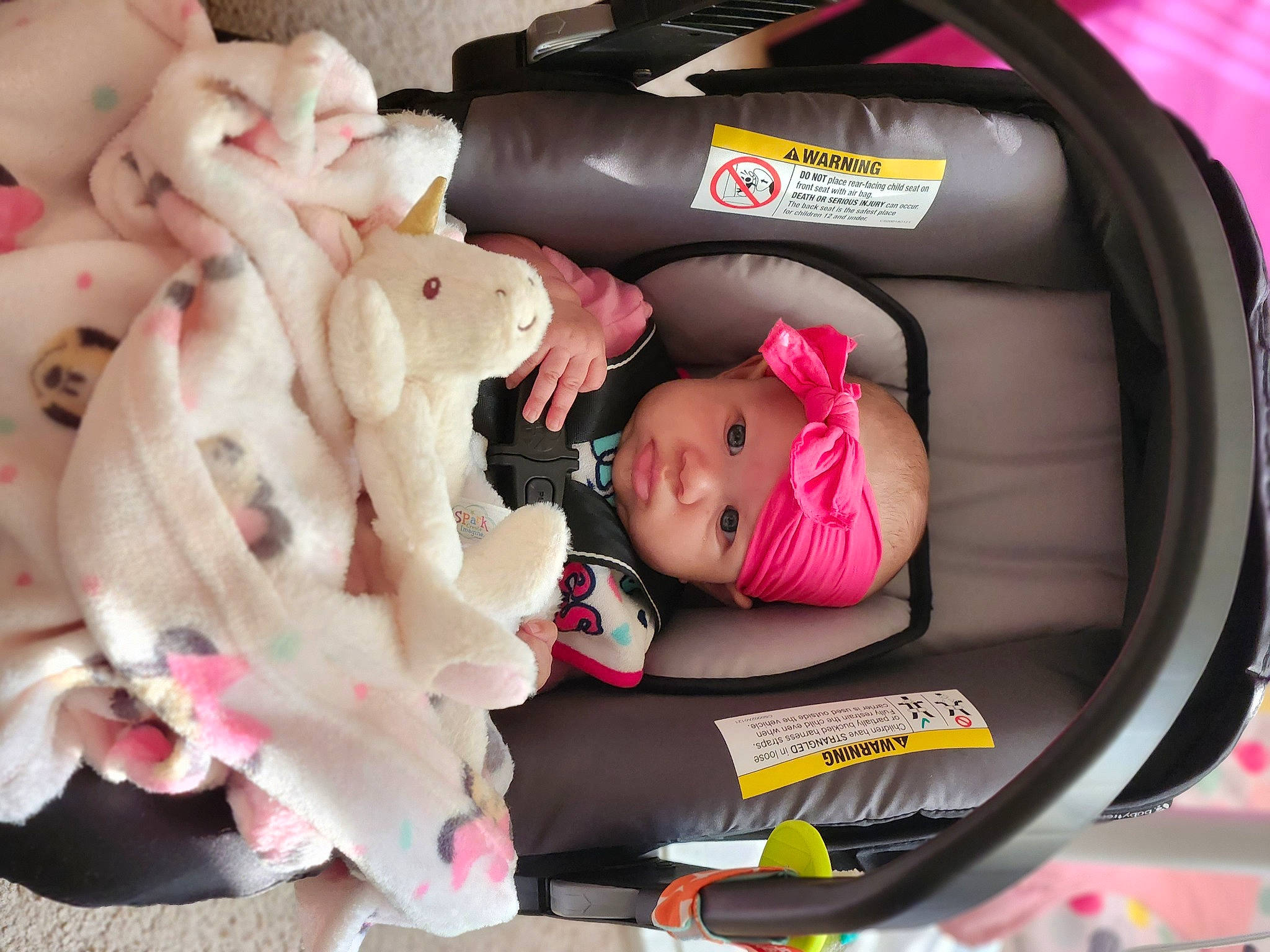 Melody is registered to the contest to win money with this photo: auto_part, automotive_design, baby, baby_carriage, baby_products, baby_safety, baby_toddler_clothing, bag, car_seat, carmine, child, comfort, headwear, magenta, motor_vehicle, person, pink, stuffed_toy, teddy_bear, toddler