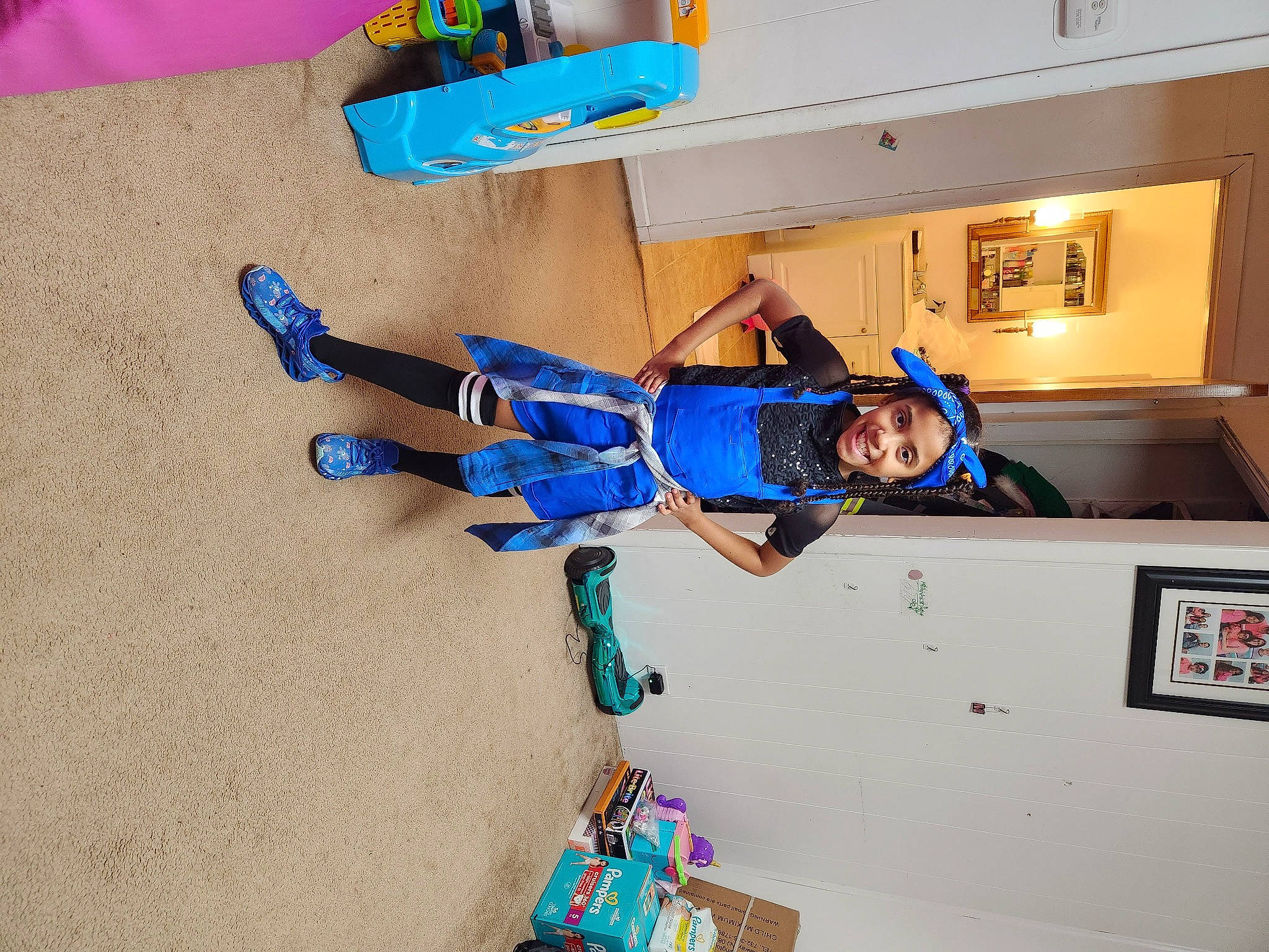 Maliyah is registered to the contest to win money with this photo: adventure, blue, electric_blue, fictional_character, flooring, fun, headwear, joy, knee, leisure, machine, person, recreation, room, sportswear, t_shirt, toddler, visual_arts, walking_shoe, wood