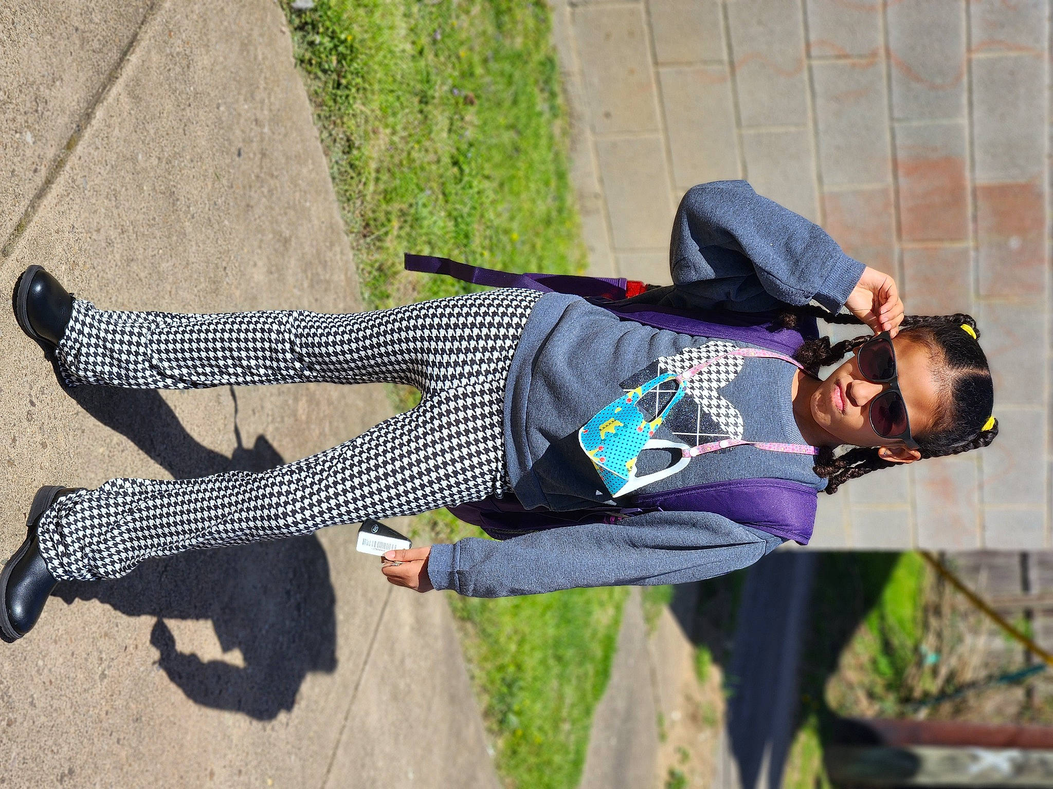 Maliyah joined the competition — help win amazing prizes! active_pants, denim, fun, grass, human_leg, knee, leisure, outdoor_shoe, pattern, person, plaid, plant, recreation, shadow, sneakers, tree, walking_shoe