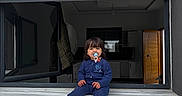 Lina a rejoint le concours — aidez-le/la à gagner de superbes lots ! child, toddler, pacifier, window, open_window, blue_clothing, white_shoes, indoor, outdoor, jacket, door, window_sill, person, face, hair, sitting, casual, young_child, home, apartment