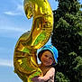 Riley participe au concours pour gagner de l'argent avec cette photo : child, toddler, balloon, number_two, blue_hat, outdoor, sky, trees, greenery, sunny, smiling, person, celebration, summer, happy, playful, holding, portrait, fun, daytime