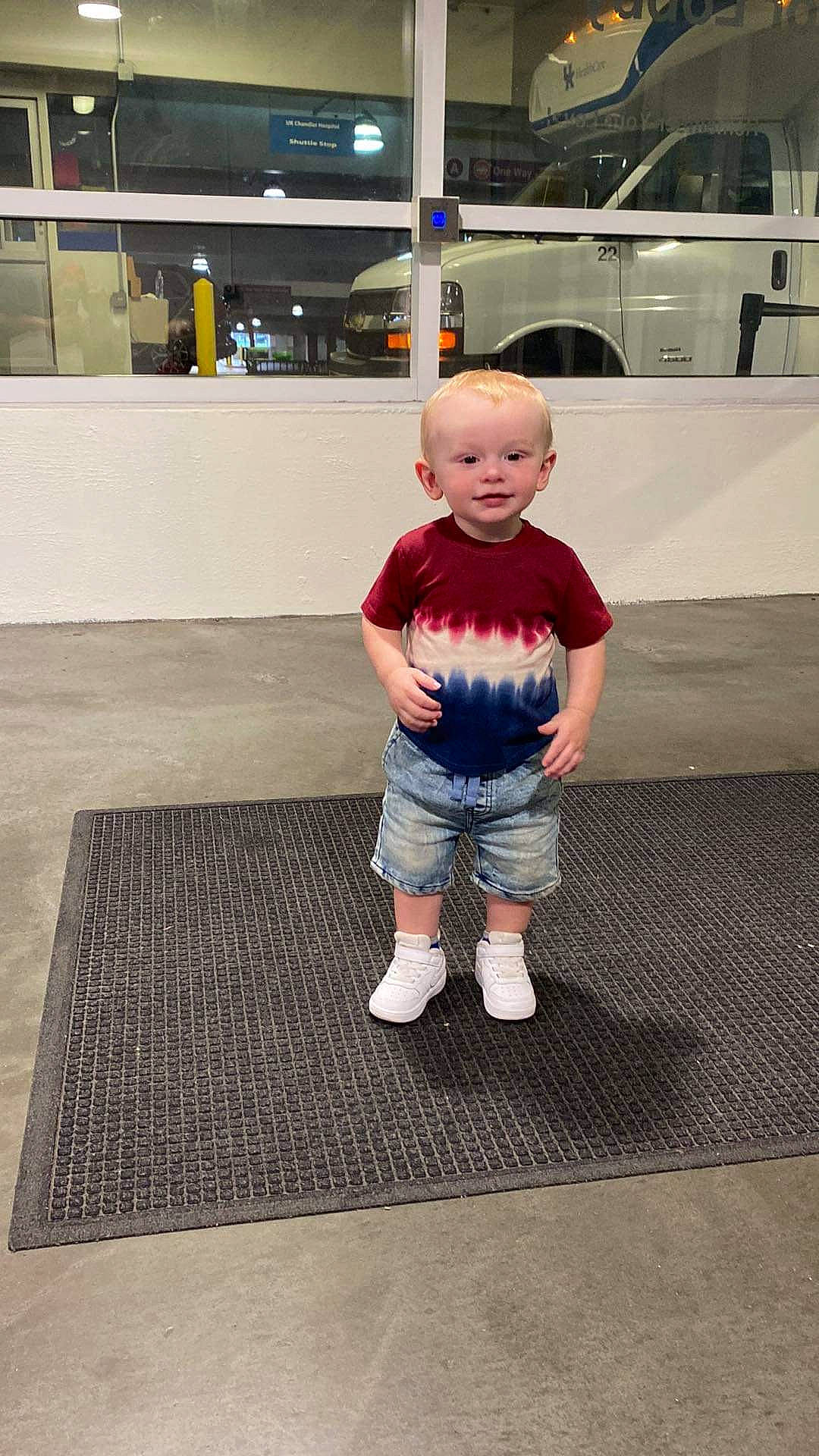 Mikey-j is registered to the contest to win money with this photo: asphalt, baby_toddler_clothing, child, denim, electric_blue, floor, flooring, fun, grey, hardwood, human_leg, knee, pattern, person, sitting, sleeve, sportswear, standing, t_shirt, toddler
