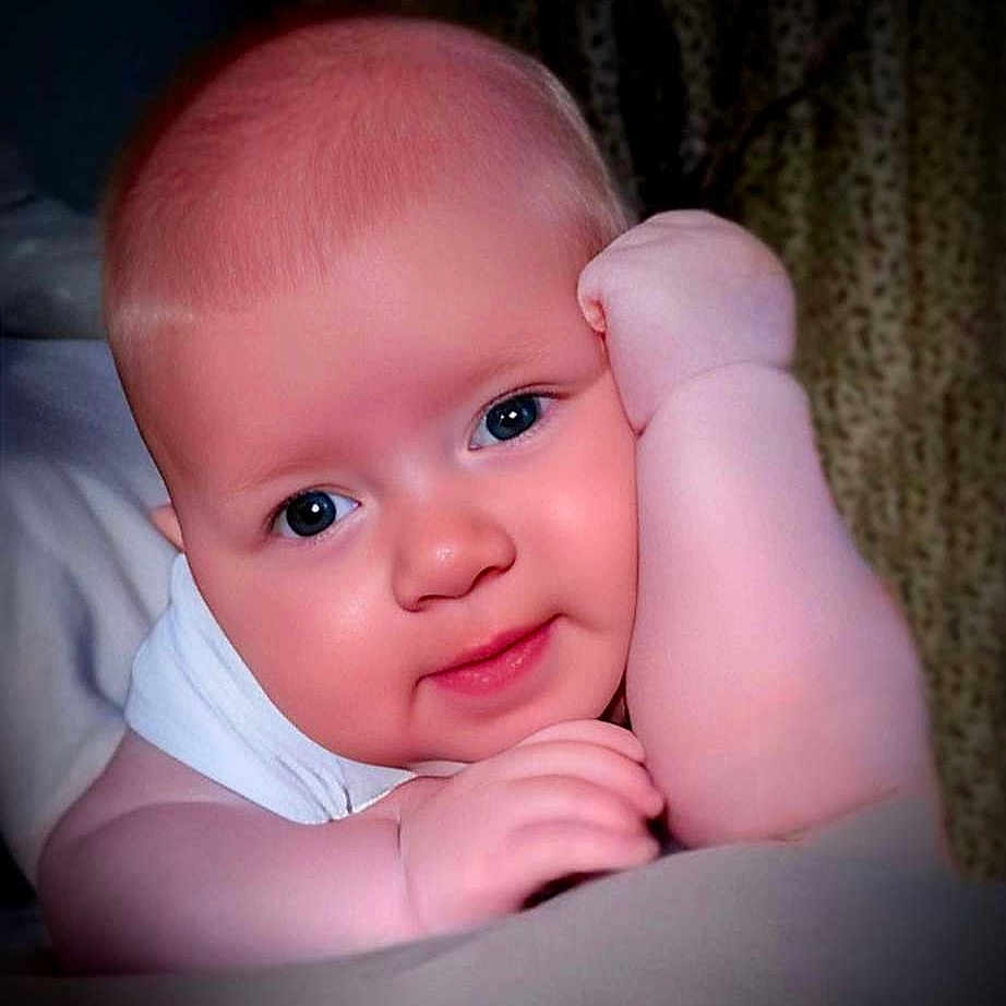 Tommy joined the competition — help win amazing prizes! baby, bed, bedroom, bodypart, face, finger, furniture, hand, happy, head, indoors, laughing, mouth, newborn, person, photography, portrait, quilt, room, smile