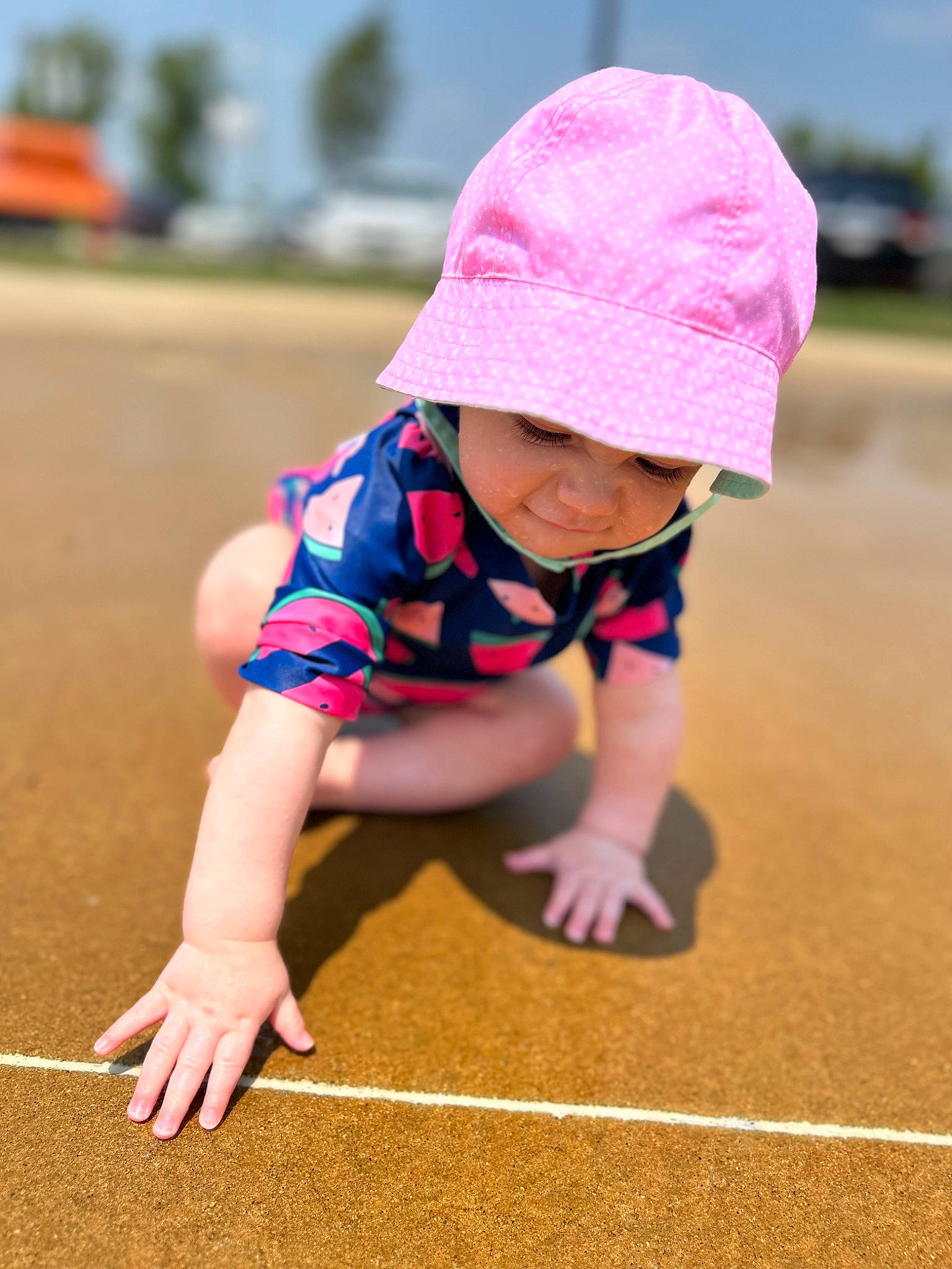 Nancy joined the competition — help win amazing prizes! baby, baby_toddler_clothing, cap, child, flooring, fun, grass, happy, headgear, headwear, leisure, magenta, people_in_nature, person, pink, plant, recreation, sand, sky, sleeve
