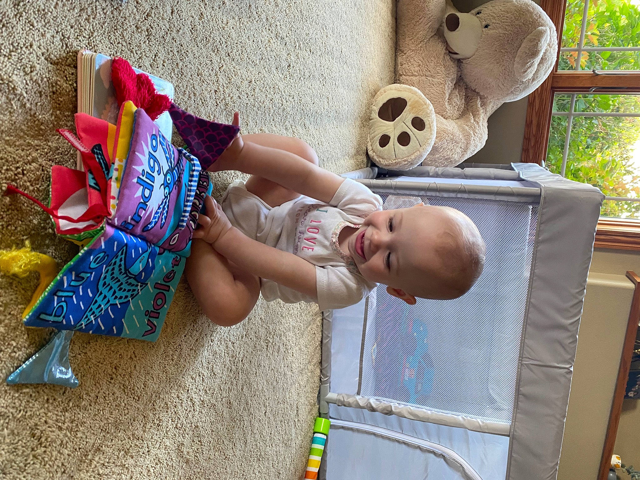 Nancy is registered to the contest to win money with this photo: art, baby, child, fun, grass, happy, human_leg, joy, leisure, pattern, person, plant, sandal, sitting, sun_hat, textile, thigh, toddler, toy, visual_arts