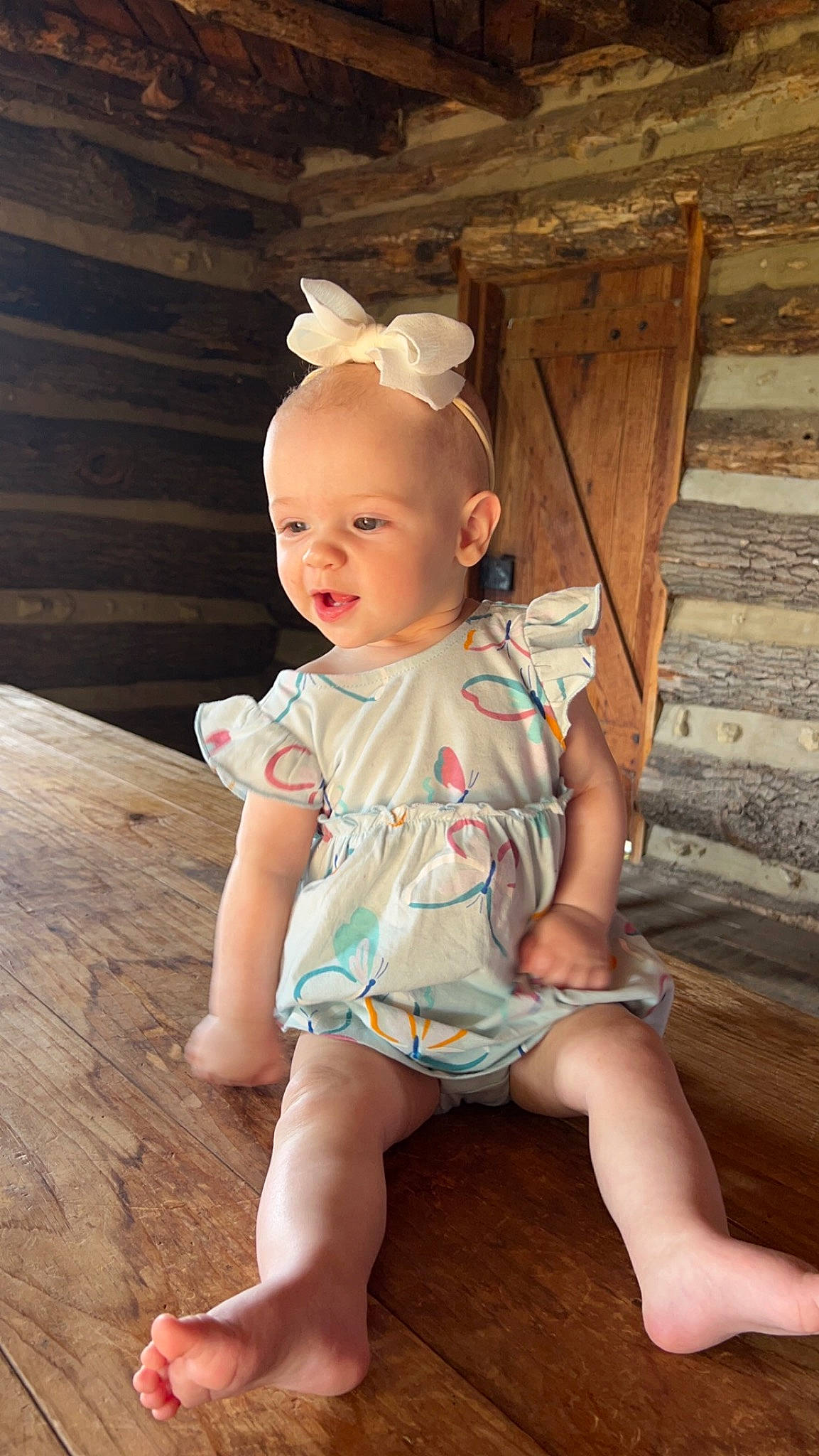 Nancy is registered to the contest to win money with this photo: baby, baby_toddler_clothing, cheek, child, dress, eye, face, flash_photography, flooring, foot, happy, human_leg, iris, leg, person, pink, skin, sleeve, thigh, toddler