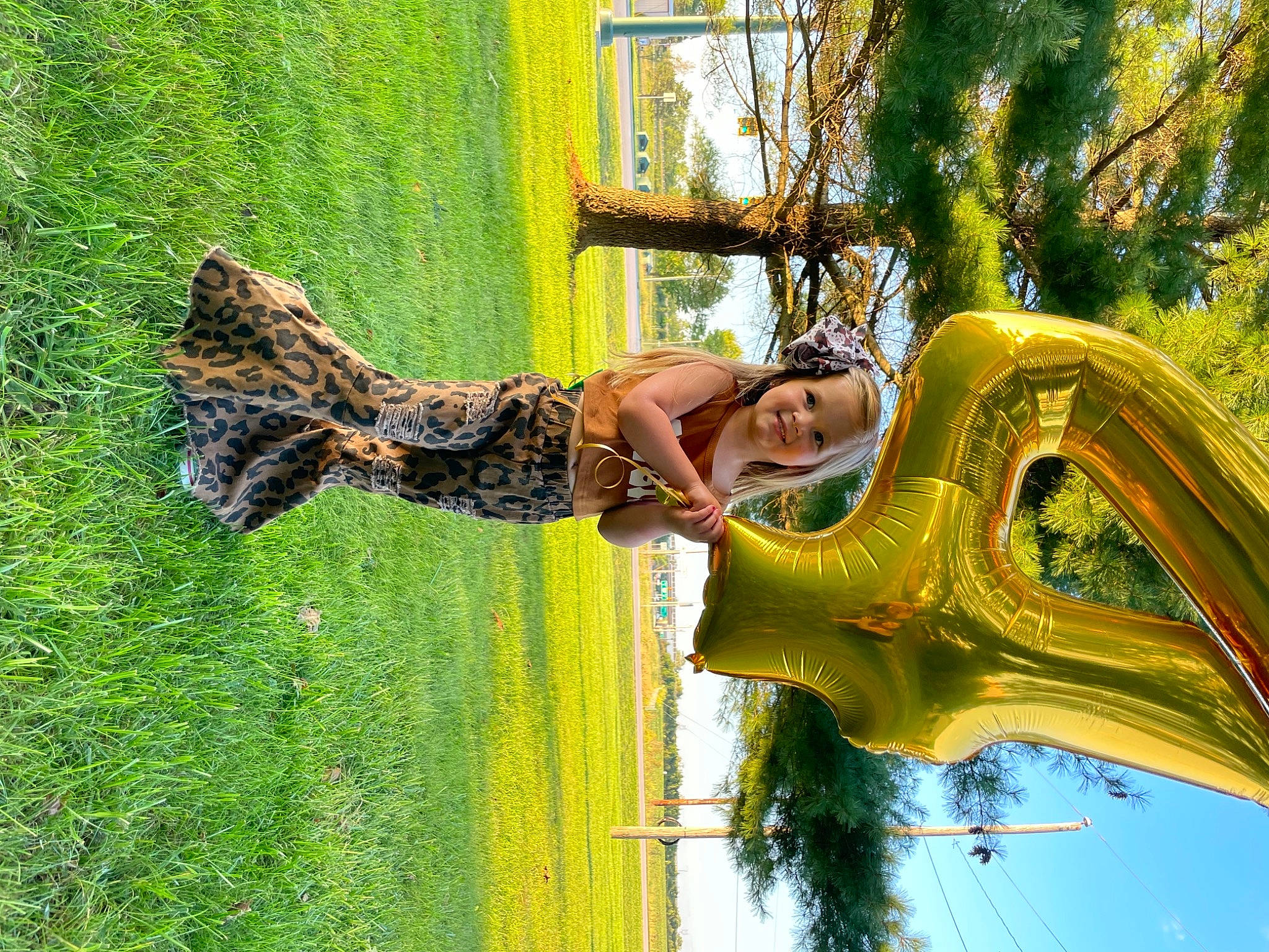 Kinslee is registered to the contest to win money with this photo: art, event, fun, garden, grass, green, happy, joy, landscape, leisure, outdoor_play_equipment, people_in_nature, person, plant, recreation, smile, summer, tree, vertebrate, visual_arts