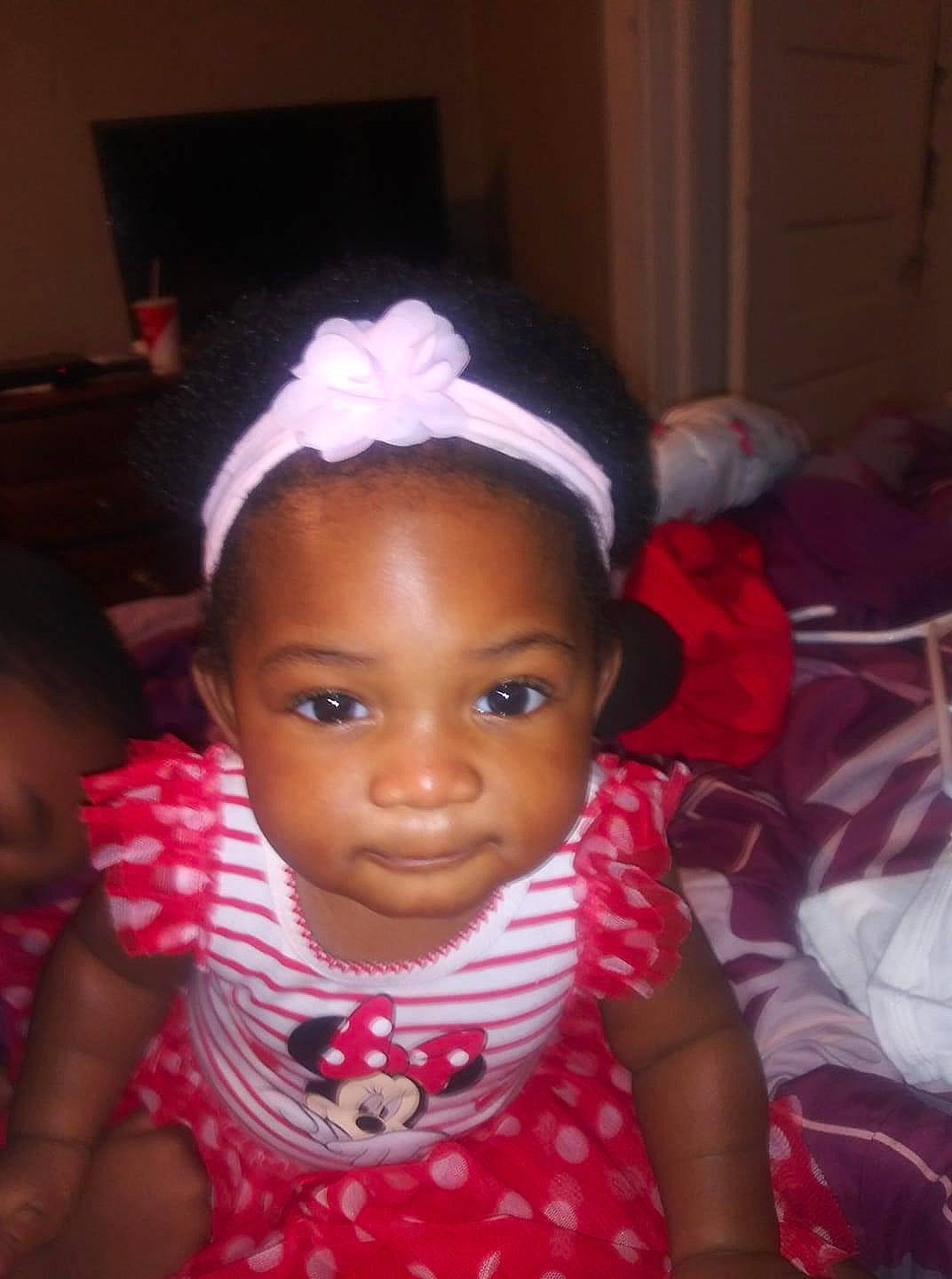 Desiree joined the competition — help win amazing prizes! baby, black_hair, cheek, child, ear, eye, eyebrow, face, forehead, fun, hair_accessory, head, headband, headgear, lip, nose, person, pink, skin, smile