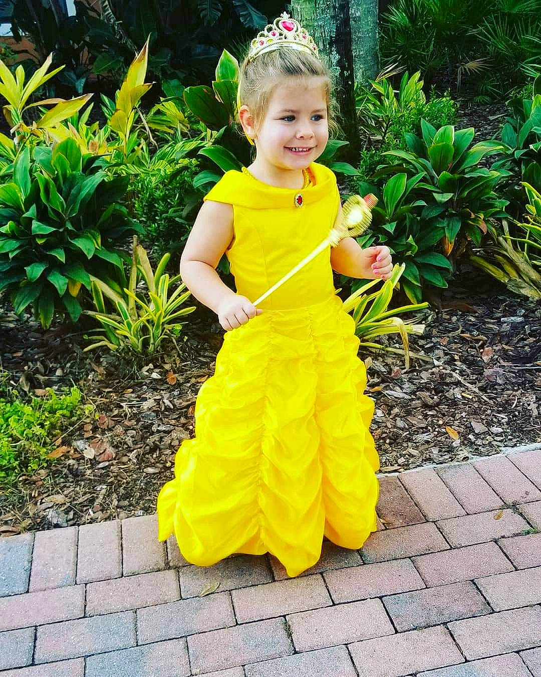 Teigan is registered to the contest to win money with this photo: child, clothing, costume, dress, flower, girl, gown, joy, person, toddler, yellow