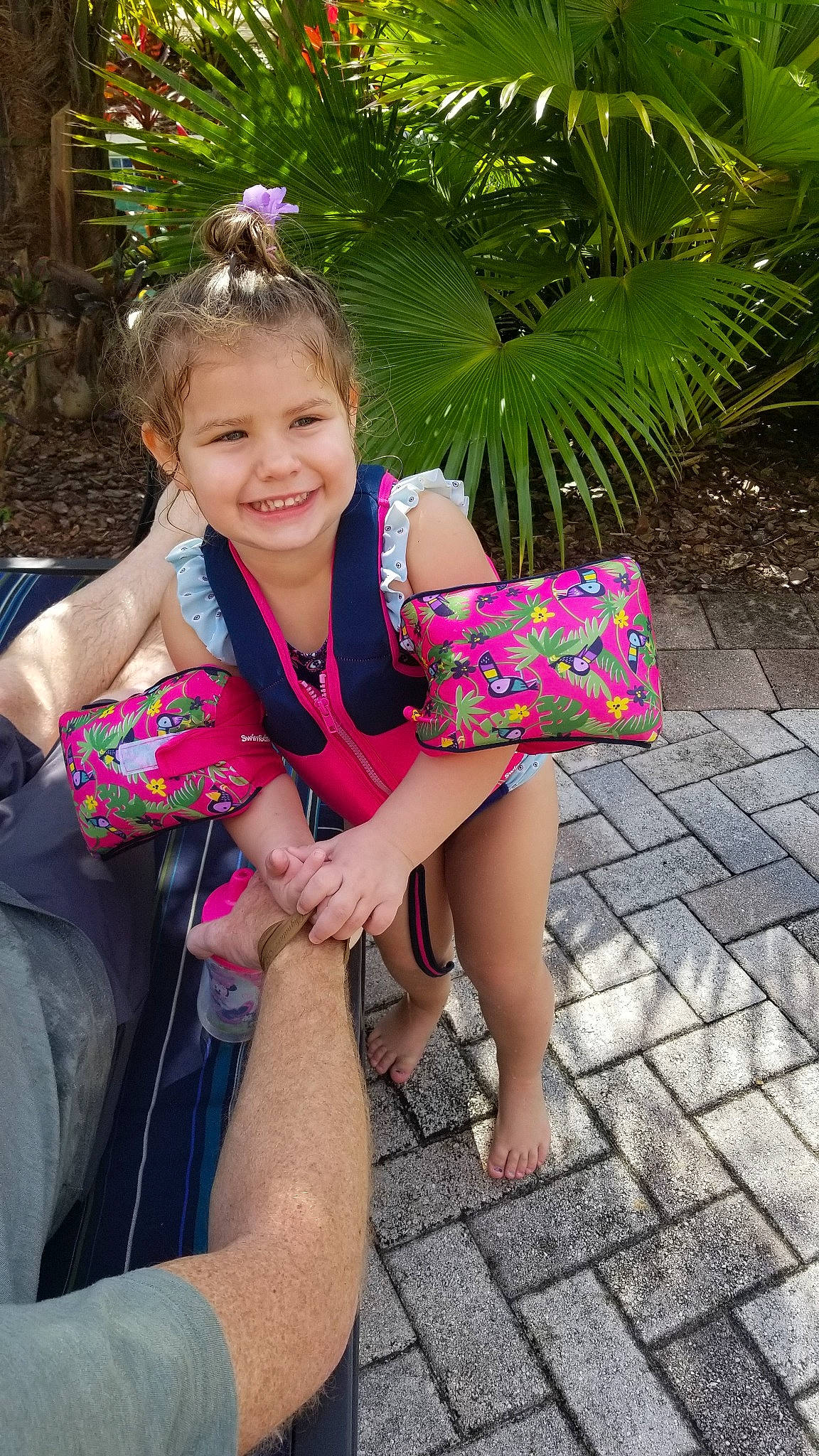 Teigan is registered to the contest to win money with this photo: child, day, facial_expression, flower, fun, girl, happiness, human_body, joy, leg, person, pink, plant, play, purple, sitting, skin, smile, summer, toddler