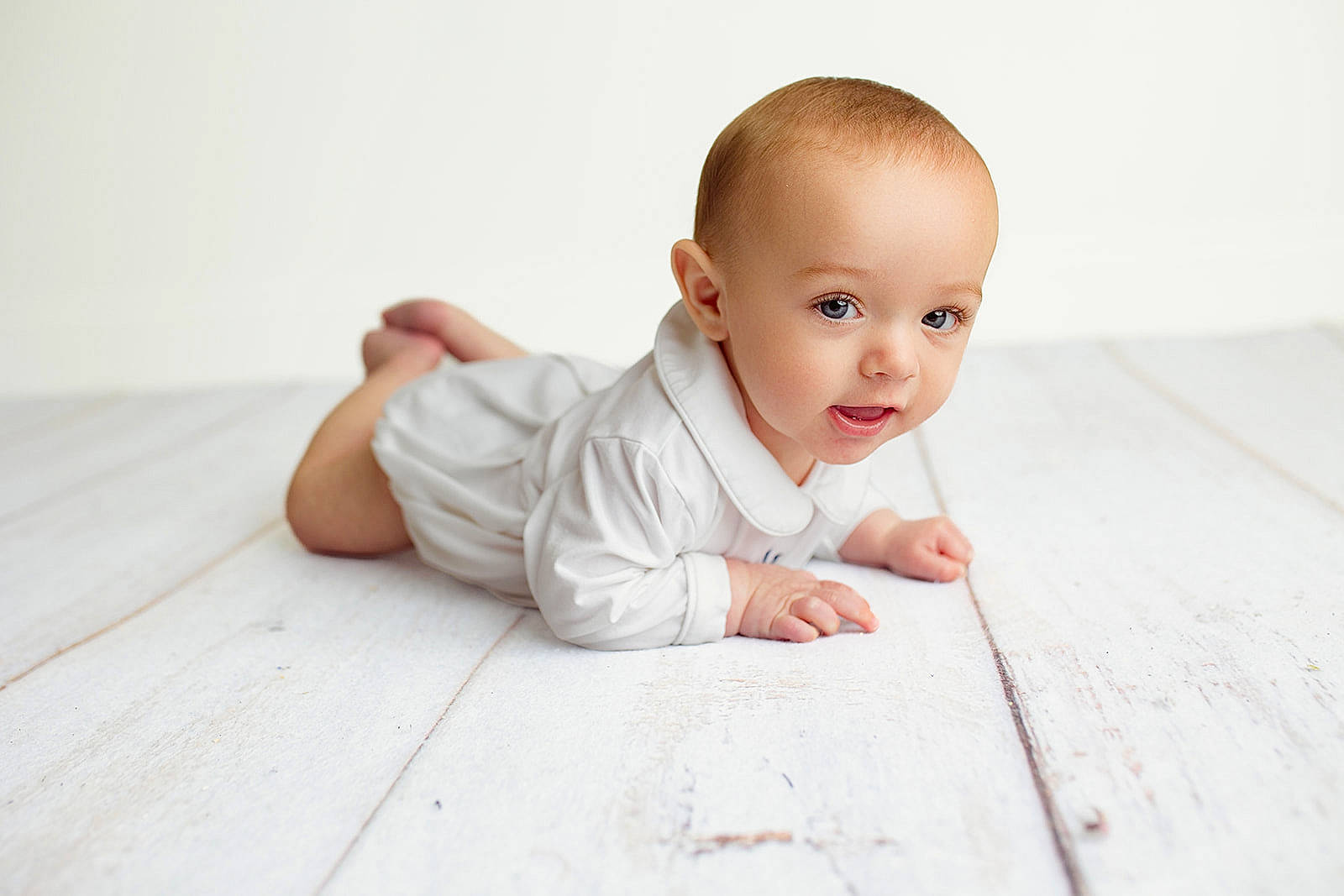 Lee is registered to the contest to win money with this photo: baby, baby_toddler_clothing, cheek, child, collar, comfort, dress, face, flash_photography, floor, flooring, happy, hardwood, person, sitting, skin, sleeve, smile, toddler, wood