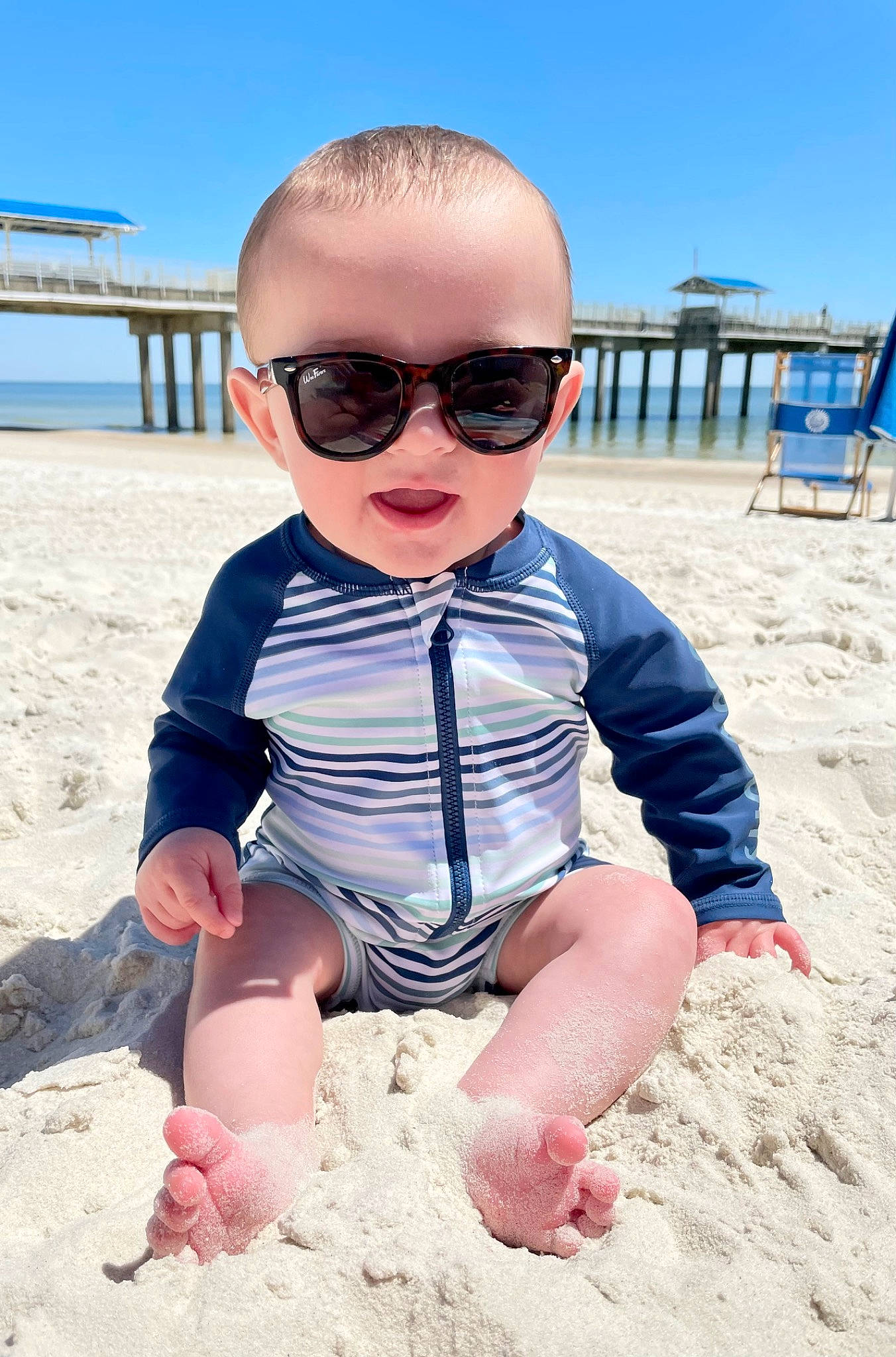 Lee joined the competition — help win amazing prizes! azure, baby_toddler_clothing, beach, blue, eyewear, fun, glasses, goggles, horizon, leisure, person, sand, sitting, sky, sleeve, summer, sunglasses, toddler, travel, vision_care