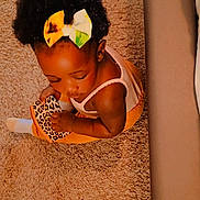 Faith joined the competition — help win amazing prizes! toddler, child, carpet, shoe, bow, hair_accessory, leopard_print, sitting, indoors, cozy, cute, baby, clothing, white_sock, floor, person, skin, head, arm, toy