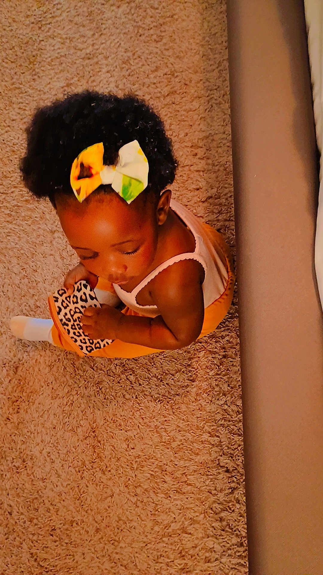 Faith joined the competition — help win amazing prizes! toddler, child, carpet, shoe, bow, hair_accessory, leopard_print, sitting, indoors, cozy, cute, baby, clothing, white_sock, floor, person, skin, head, arm, toy