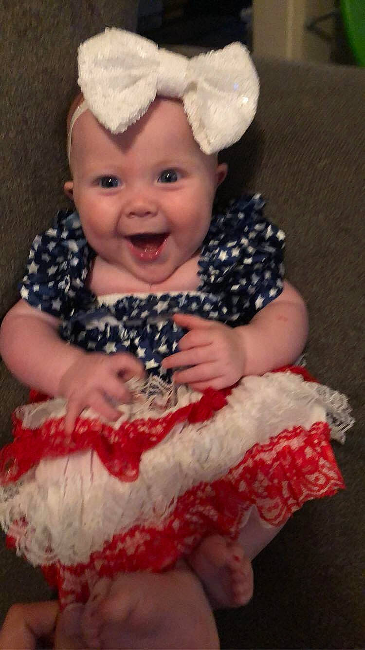 Laney joined the competition — help win amazing prizes! baby, baby_toddler_clothing, cap, costume_hat, embellishment, event, eye, happy, headband, headgear, headpiece, headwear, magenta, pattern, peach, person, pink, red, skin, sleeve