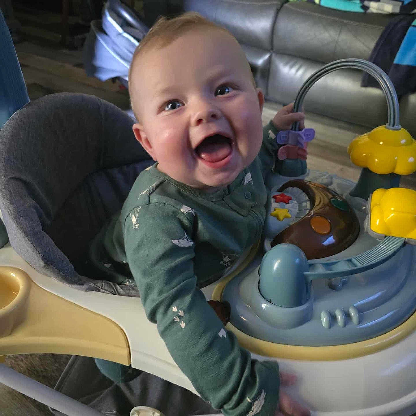 Nico joined the competition — help win amazing prizes! baby, baby_walker, child, clothing, colorful, couch, floor, furniture, happy, home, indoor, infant, joy, man, person, play, relaxing, seat, smiling, toy