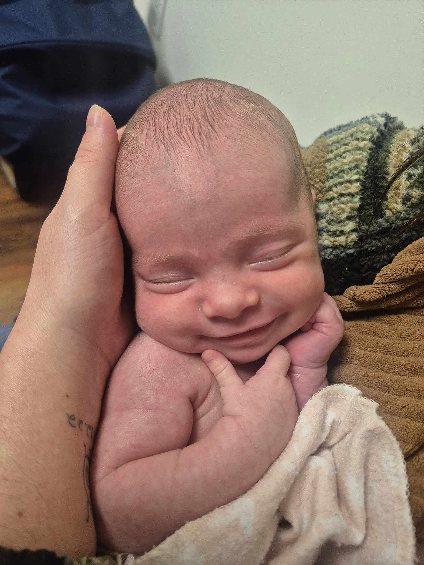 Lelanie is registered to the contest to win money with this photo: newborn, baby, smiling, face, hand, skin, blanket, wrapped, peaceful, sleeping, infant, closeup, portrait, cozy, soft, human, child, cute, resting, warm