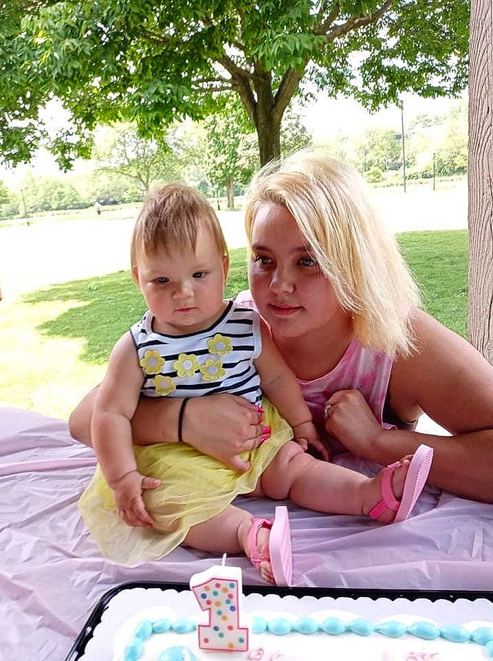 Leylah is registered to the contest to win money with this photo: baby, cake_decorating_supply, face, food, fun, grass, happy, leisure, people, person, photograph, pink, plant, recreation, sharing, sugar_cake, summer, table, tableware, toddler