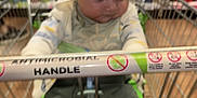 Erik is registered to the contest to win money with this photo: baby, blur, child, clothing, floor, handle, hood, indoors, infant, metal, pants, person, product, retail, shelf, shopping_cart, sitting, socks, store, supermarket