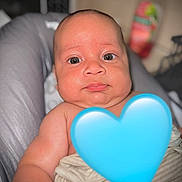 Jeriah joined the competition — help win amazing prizes! baby, infant, face, eyes, cheeks, blanket, cushion, skin, indoors, portrait, child, young, seat, expression, closeup, person, human, soft, blurred_background, blue_heart