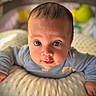 Jeriah is registered to the contest to win money with this photo: baby, infant, face, eyes, blanket, clothing, soft, cute, portrait, child, indoor, cozy, lying_down, human, skin, head, expression, warm, closeup, adorable