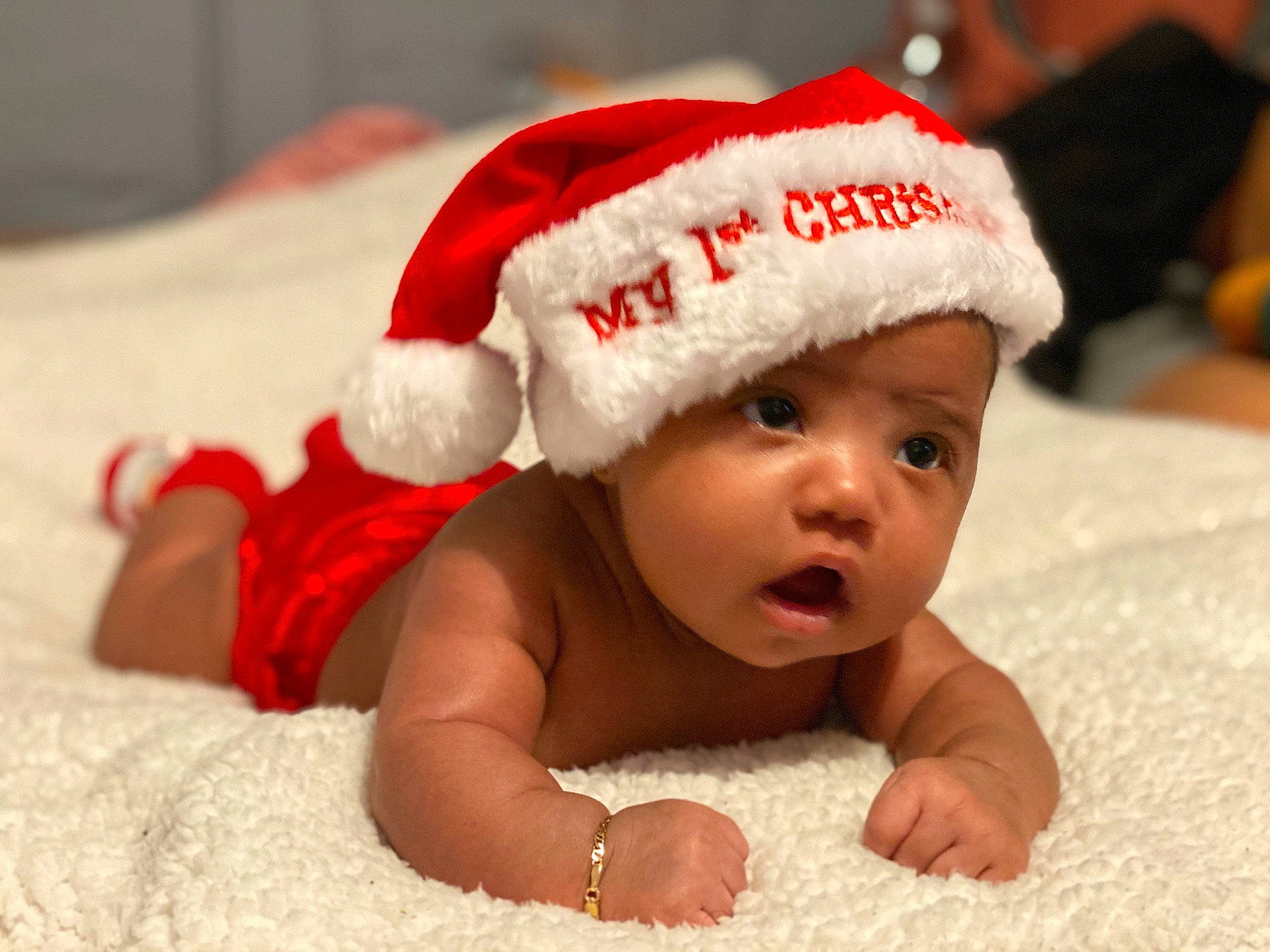 Alexandralys Burgos joined the competition — help win amazing prizes! baby, baby_laughing, cap, child, christmas, christmas_eve, costume_accessory, fictional_character, fun, hat, head, headgear, headwear, holiday, knit_cap, person, santa_claus, smile, toddler