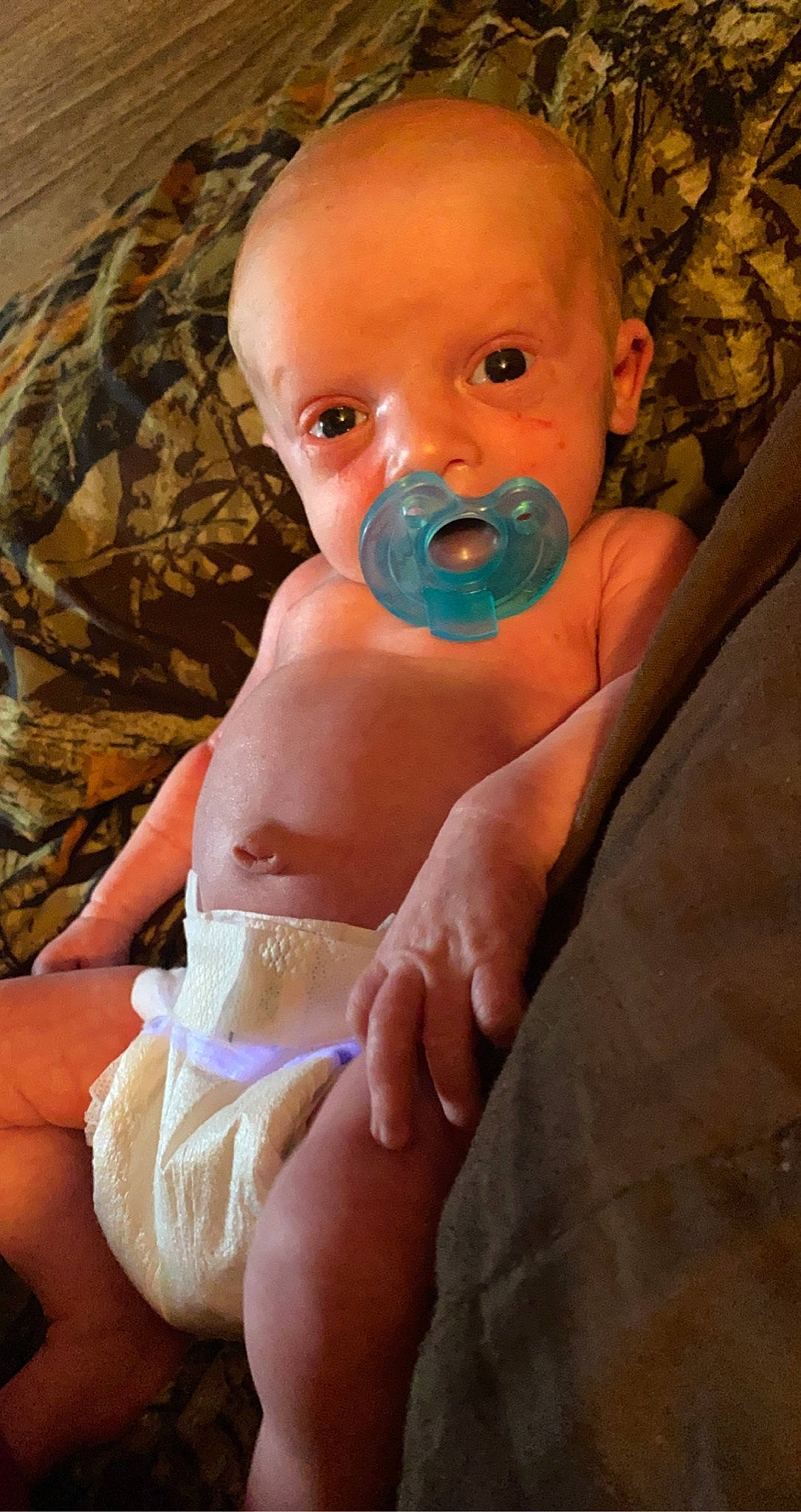 Oryan is registered to the contest to win money with this photo: baby, baby_toddler_clothing, cheek, comfort, eye, eyelash, finger, gesture, hand, happy, human_body, lip, mouth, nail, nose, person, pink, skin, stomach, thumb