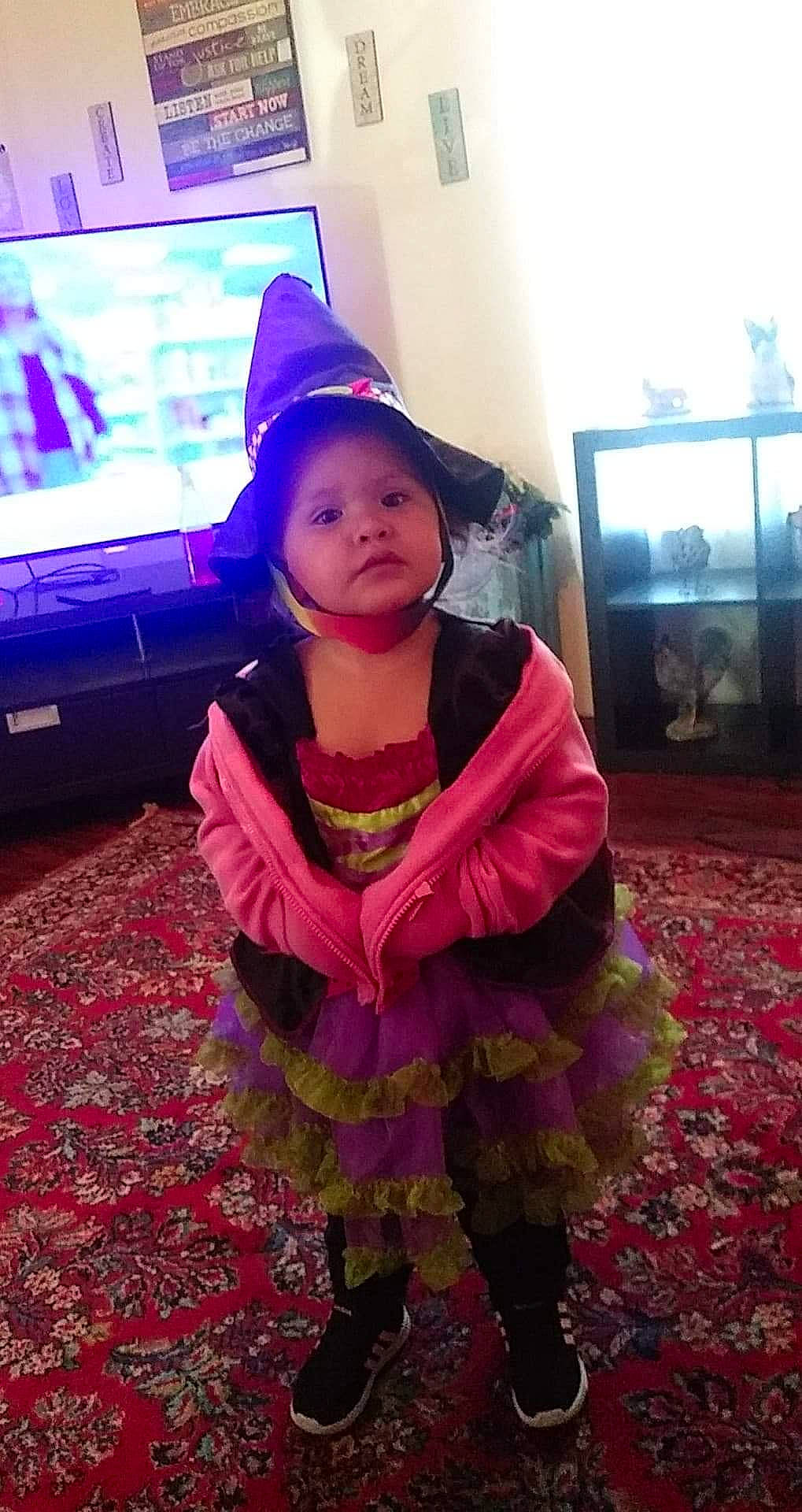 Jorja is registered to the contest to win money with this photo: child, costume, fashion_accessory, magenta, person, pink, purple, smile, toddler