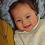 Siete Meses participe au concours pour gagner de l'argent avec cette photo : baby, blanket, cheeks, child, close_up, cozy, face, happy, head, human, indoors, infant, person, portrait, relaxing, smile, soft_texture, teeth, warm_colors, white_clothing