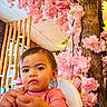 Owena a rejoint le concours — aidez-le/la à gagner de superbes lots ! toddler, child, pink_flowers, blossoms, tree, indoor, wooden_table, high_chair, person, portrait, cute, curious, casual_clothing, face, hands, interior, decor, plant, nature, young_child