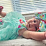 arm, baby, blanket, blind, bow, child, colorful, cute, dress, fabric, foot, happy, headband, indoor, infant, portrait, smile, soft_light, tutu, window