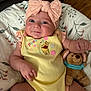 Maple is registered to the contest to win money with this photo: baby, infant, smiling, headband, bow, yellow_outfit, pooh, plush_toy, stuffed_animal, cushion, floral_pattern, wooden_floor, baby_clothing, cute, child, person, indoors, soft_toy, happy, portrait