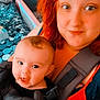Anastasia participe au concours pour gagner de l'argent avec cette photo : baby, baby_carrier, casual, child, closeup, clothing, drooling, face, hair, happy, holding, home, indoor, infant, person, portrait, red_hair, skin, smiling, woman