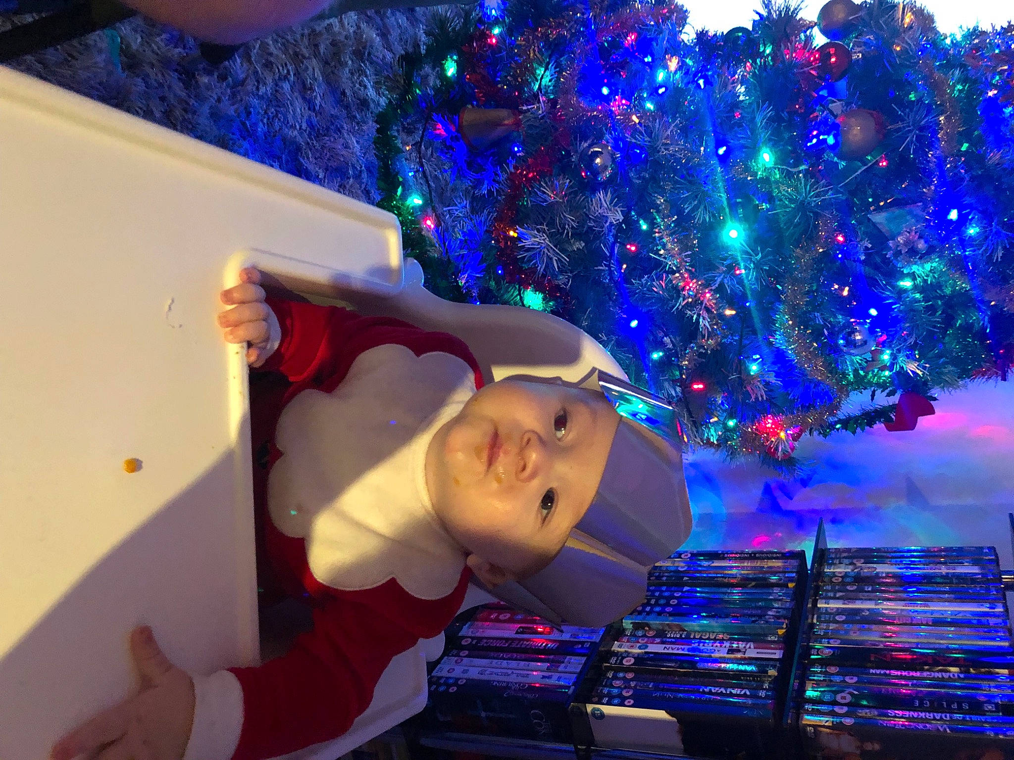 Kaleb joined the competition — help win amazing prizes! blue, christmas, christmas_decoration, christmas_eve, christmas_lights, christmas_ornament, christmas_tree, electric_blue, event, fun, headwear, holiday, holiday_ornament, light, lighting, ornament, person, plant, purple, space