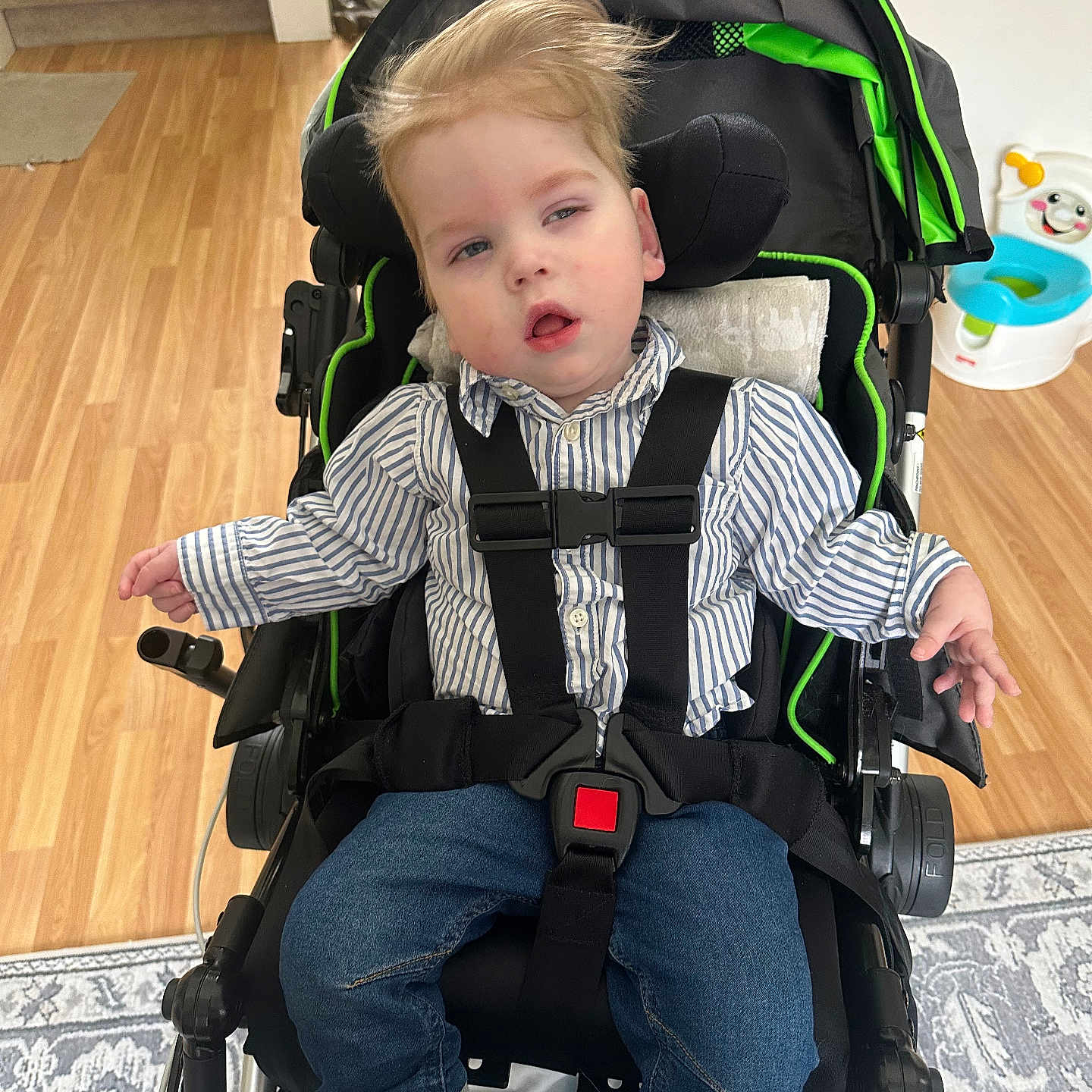 Colton joined the competition — help win amazing prizes! baby, bodypart, clothing, face, footwear, furniture, glove, hardwood, head, homedecor, jeans, pants, person, photography, portrait, rug, shoe, sitting, stroller, wood