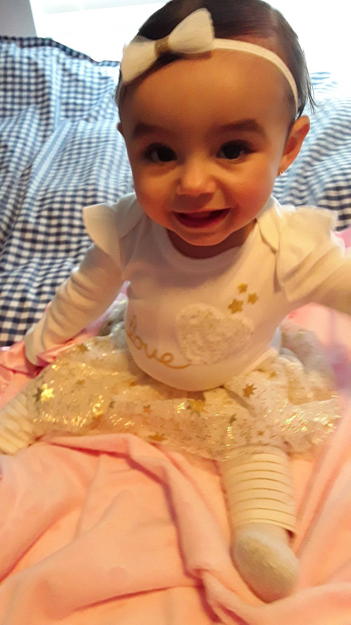 True is registered to the contest to win money with this photo: baby, baby_toddler_clothing, cheek, child, dress, face, head, joy, person, pink, skin, smile, toddler