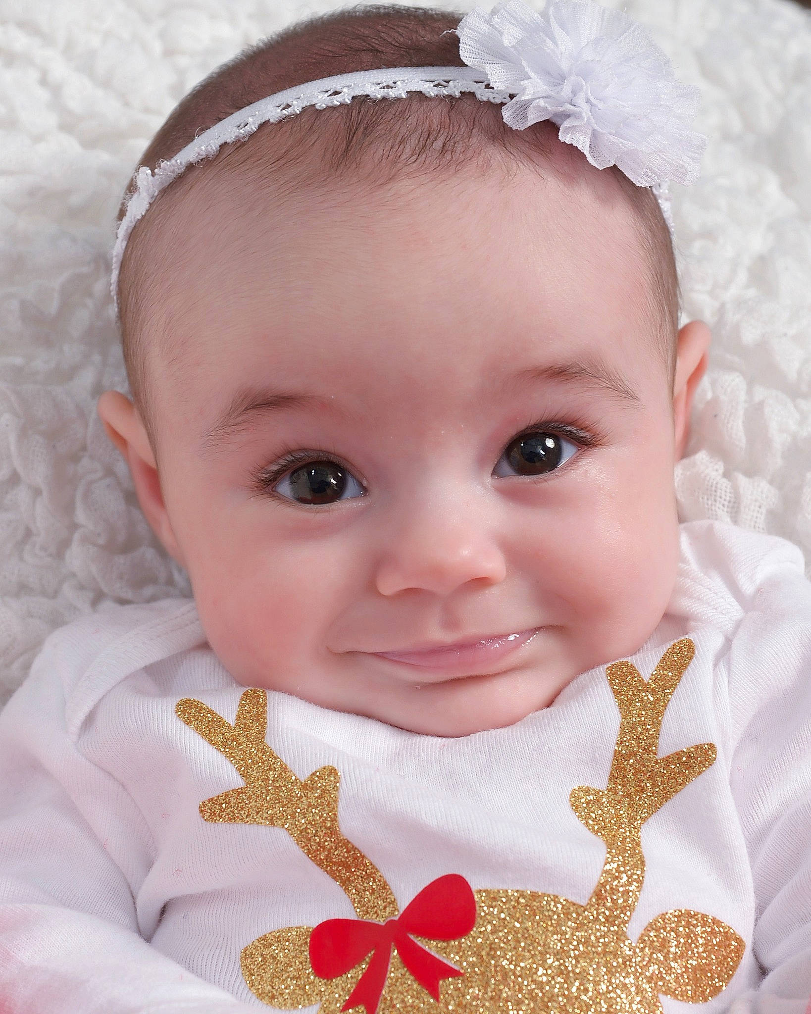 True is registered to the contest to win money with this photo: baby, baby_toddler_clothing, cheek, child, close_up, eye, face, forehead, hair_accessory, head, headband, headgear, headpiece, joy, lip, person, pink, product, skin, smile