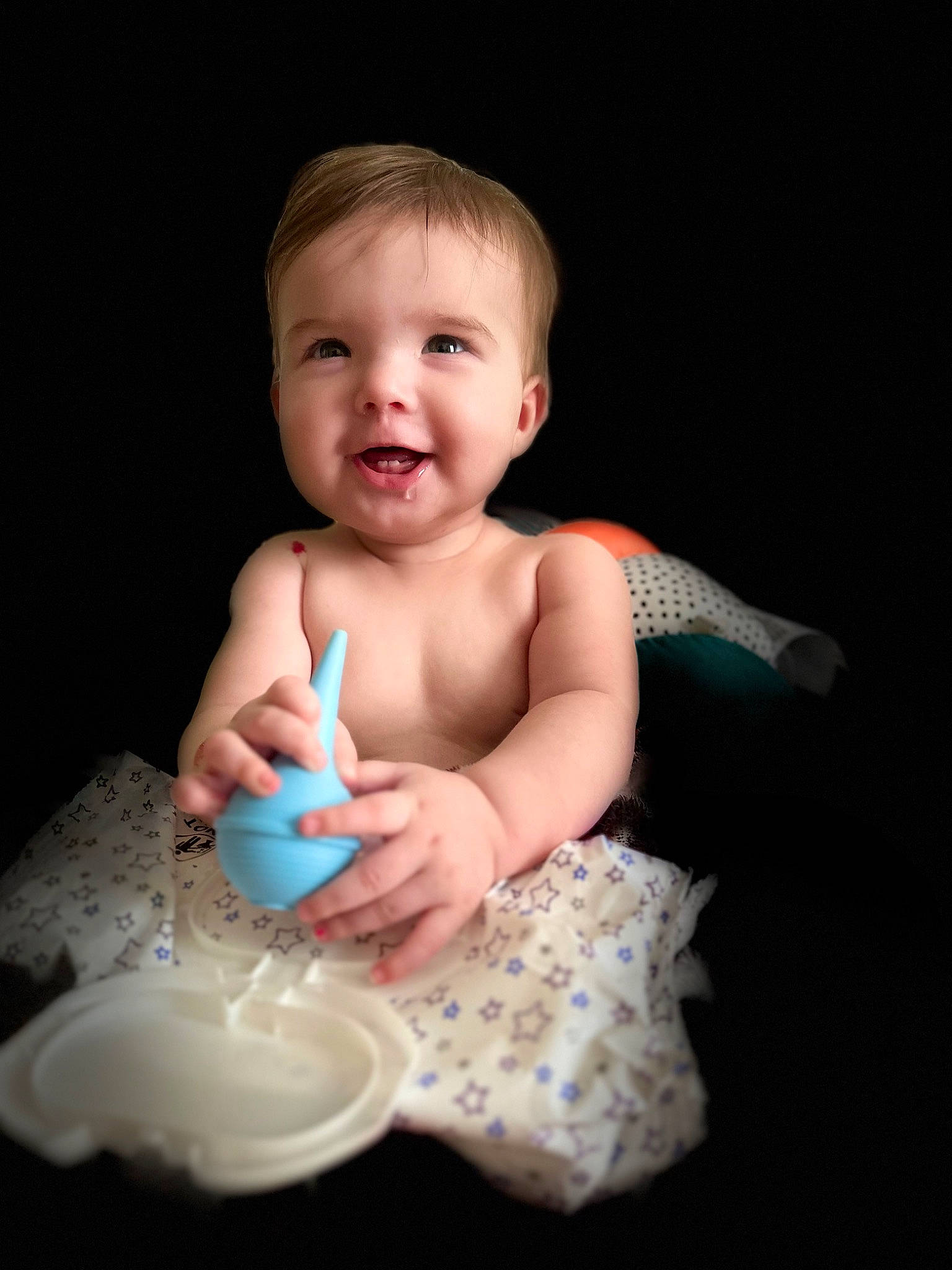 Amani joined the competition — help win amazing prizes! abdomen, arm, baby, baby_toddler_clothing, cheek, child, drinkware, finger, flash_photography, gesture, happy, iris, nail, person, sitting, skin, smile, stomach, thumb, toddler