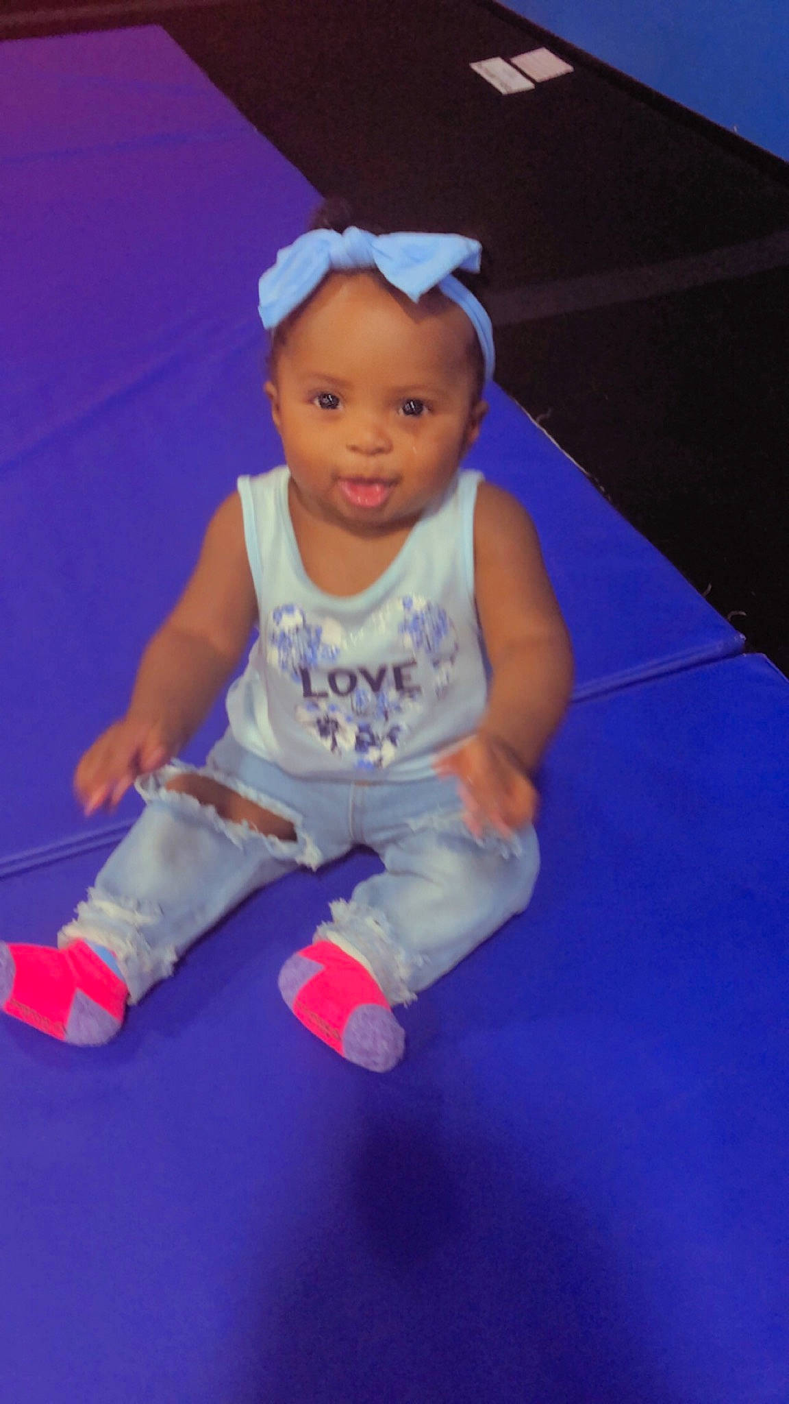 Amorah is registered to the contest to win money with this photo: baby, baby_products, baby_toddler_clothing, barefoot, cap, child, electric_blue, floor, flooring, fun, happy, human_leg, knee, person, pink, shorts, sleeve, smile, sportswear, t_shirt