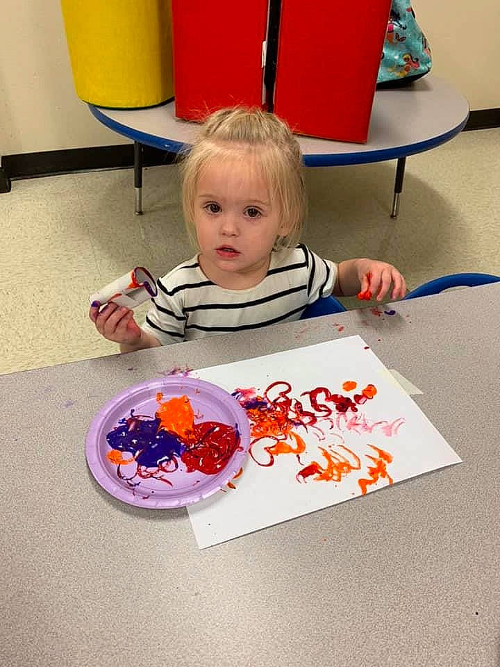 Taryn is registered to the contest to win money with this photo: child, food, orange, person, play, toddler