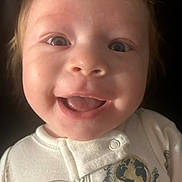 Camden is registered to the contest to win money with this photo: baby, infant, child, smiling, happy, face, portrait, close_up, wide_eyes, open_mouth, gummy_smile, indoor, onesie, clothing, space_theme, planet, moon, soft_lighting, photography, adorable