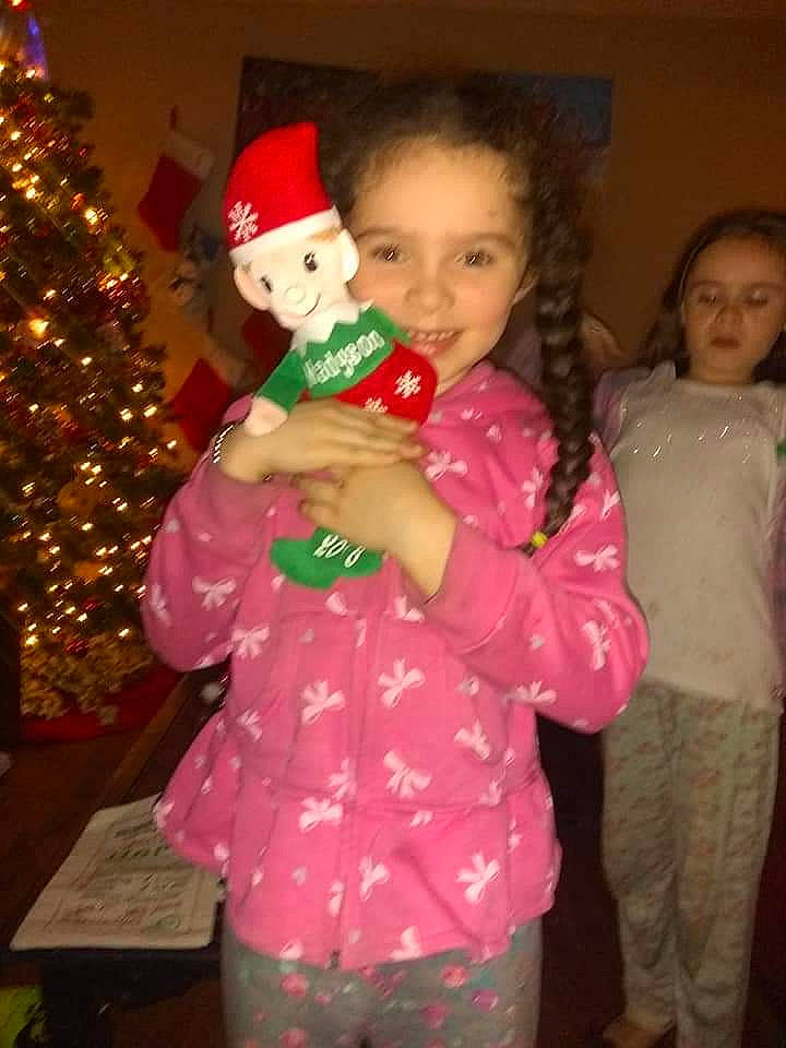 Madyson joined the competition — help win amazing prizes! child, christmas, christmas_decoration, christmas_eve, christmas_lights, christmas_ornament, christmas_tree, event, fictional_character, fun, happy, holiday, interior_design, joy, person, smile, toddler, tree