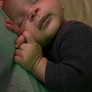 Niklaus is registered to the contest to win money with this photo: baby, child, closeup, clothing, comfort, cozy, cuddle, cute, face, hands, head, indoors, infant, peaceful, portrait, relaxation, resting, skin, sleeping, soft